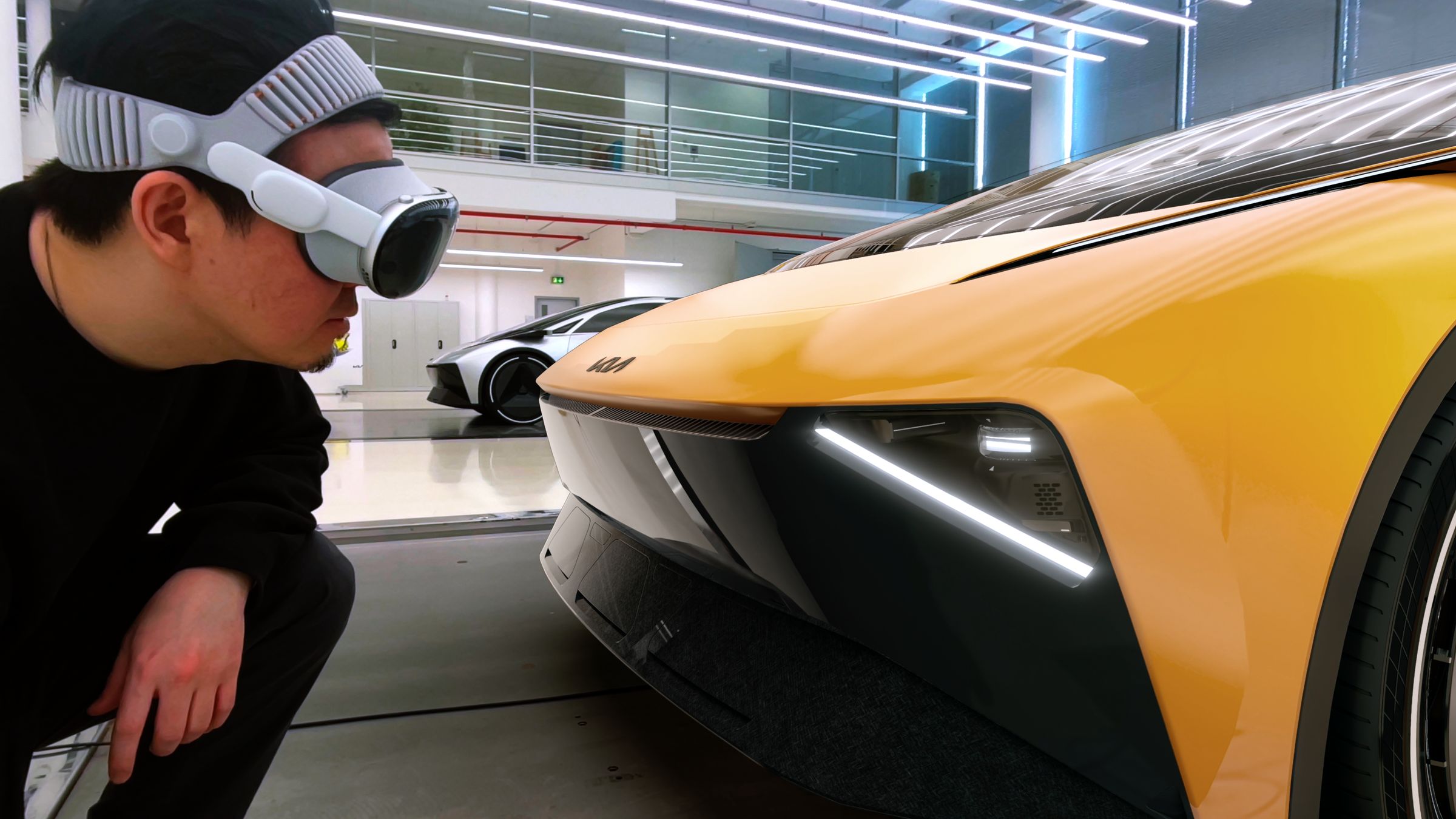 Designer in Vision Pro examining the front headlight of a yellow Kia concept up close.